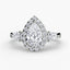 Three stone halo diamond engagement ring with a pear-shaped center stone and two pear shaped side stone on a white background