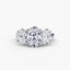 Three-stone oval diamond ring on a white background