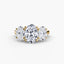 Three-stone oval diamond ring with gold setting on a white background