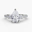 Three Stone diamond ring with a pear-shaped center stone round diamond on the sides and round brilliants pave on the shank on a white background