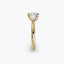 Profile view of The Seris showing cushion cut diamond in secure double prong setting yellow gold