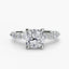 White Gold ring with a large cushion cut diamond and smaller marquise shaped and round cut diamonds on the band against a white background