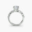 Diamond ring with a central cushion-shaped diamond and baguette side stones on a white background