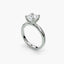 Side view of The Seris showing cushion cut diamond in secure double prong setting white gold