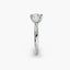 Profile view of The Seris showing cushion cut diamond in secure double prong setting white gold