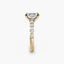 Gold ring with a diamond on a white background