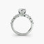 Diamond ring with a central gemstone and smaller stones on a white background