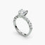 Diamond ring with a central gemstone and smaller stones on a white background