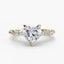 Heart-shaped diamond ring with gold setting on a white background