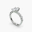 Diamond ring with a marquise-shaped center stone on a white background.