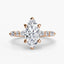 Rose gold ring with a marquise-cut diamond on the center and side stones marquise round on a white background