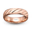 A 14K rose gold men's wedding band with a brushed diagonal groove design.