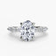 Diamond ring with a central oval-cut diamond and smaller round and marquise diamonds platinum on a white background
