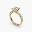 Gold ring with a large central oval diamond and smaller diamonds on the band against a white background