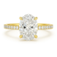 Oval lab diamond engagement ring with micro pave on the shank yellow gold