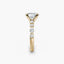 Gold ring with a oval diamond on a white background