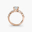 Rose gold ring with a oval-shaped diamond on a white background