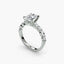 Diamond ring with a central gemstone and smaller stones on a white background