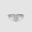 Heart-shaped diamond ring on a white background