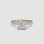 Gold ring with a large central princess diamond and smaller diamonds on the band against a white background