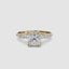 Gold ring with a large cushion cut diamond and smaller marquise shaped and round cut diamonds on the band against a white background