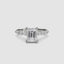 White gold ring with a large emerald-cut diamond and smaller diamonds on the sides against a white background