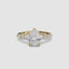Pear shaped diamond ring with marquise and round side stones yellow gold on a white background