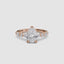 Rose gold ring with pear-shaped diamond on a white background