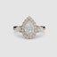 Rose gold three stone ring with a pear-shaped diamond and halo on a white background