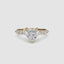 Heart-shaped diamond ring with gold setting on a white background