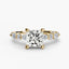 Gold ring with a large central princess diamond and smaller diamonds on the band against a white background