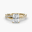 Gold ring with a radiant cut diamond twisted pave shank on a white background