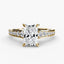 Gold ring with a radiant cut diamond and micro pave round diamonds on the shank on a white background