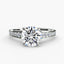 White gold ring with a large round diamond and smaller diamonds on the band against a white background