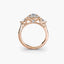 Rose gold ring with diamonds on a white background