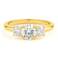 A three-stone round lab created diamond engagement ring in yellow gold setting.
