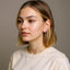 Woman wearing climber diamond earrings