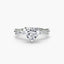 Diamond ring with a heart-shaped center stone on a white background