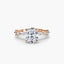 Rose gold ring with a large oval diamond and smaller diamonds on a white background