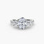 Three stone ring oval diamond round side and micro pave shank white gold on a white background