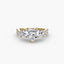Three stone heart shaped diamond ring with round diamonds on the side and u micro pave setting on twisted shank yellow gold on white background