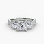 Three stone princess-cut diamond ring with round side stone and u micro pave setting on twisted shank white gold on white background