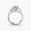 Diamond ring with side stone in white gold on a white background