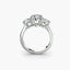 Diamond white gold ring with three stones on a white background