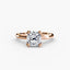 Rose gold ring with a cushion diamond on a white background