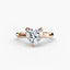 Rose gold ring with a heart-shaped diamond on a white background