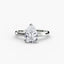 Diamond ring with a pear-shaped gemstone on a white background