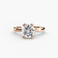 Rose gold ring with a large round diamond on a white background