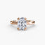 Rose gold ring with a large oval diamond on a white background