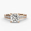 Rose gold diamond ring with a large central princess cut diamond and smaller diamonds on the band against a white background